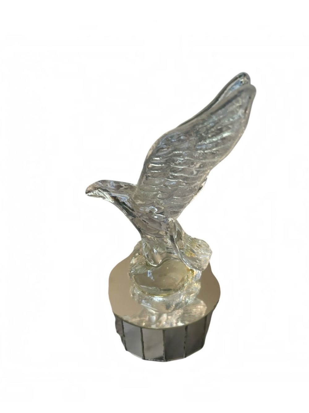 Musical glass American Bald Eagle sculpture perched atop a round pedestal